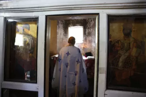 Priest at altar preparing for a wedding ceremony