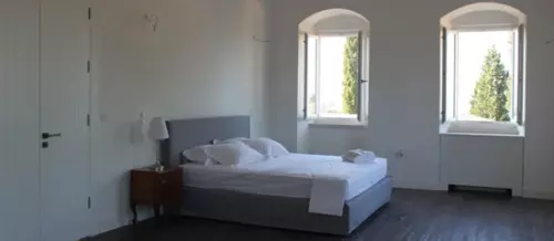 Master suite bedroom with white free standing bath